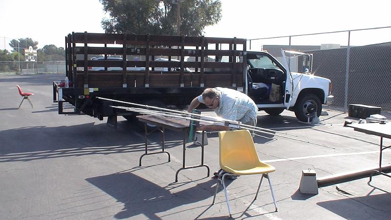 DSC04764.JPG - Steve Maxsted tightening the elements on the VHF/UHF log periodic antenna.