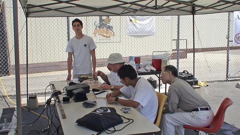 DSC04777.JPG - Alex De Losa (Scout Troop 378), Mel Hughes K6SY, Christopher Sue KI6DDJ (Scout Troop 586) , and Boy Scout Troop visitor at Get On the Air (GOTA) station.