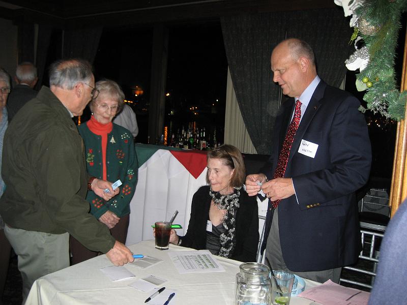 IMG_1835.JPG - Herb KO6RC and Joan Stark check in, while Maureen and Peter KE6JPM Landon distribute tickets.
