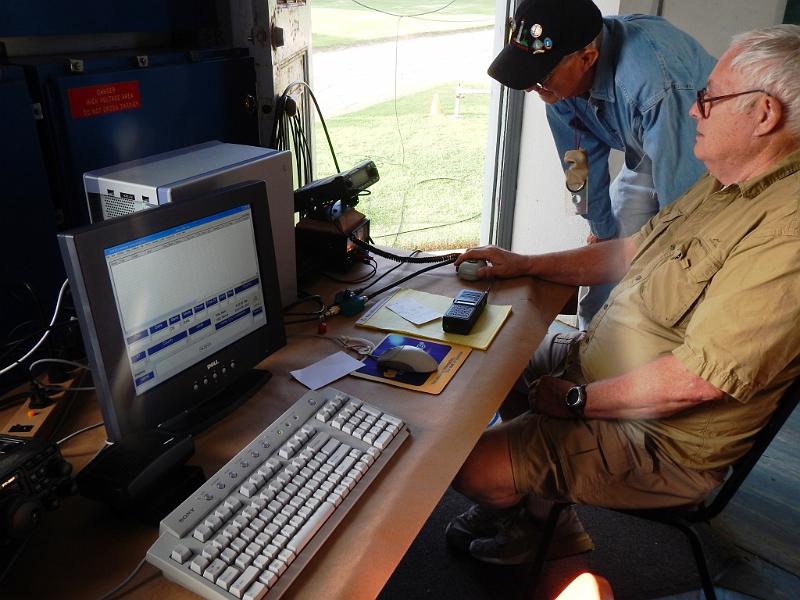 051a.jpg - Bob Closson, W6HIP, and Bill Harper, WA6ESC, check out our UHF radio in the lighthouse