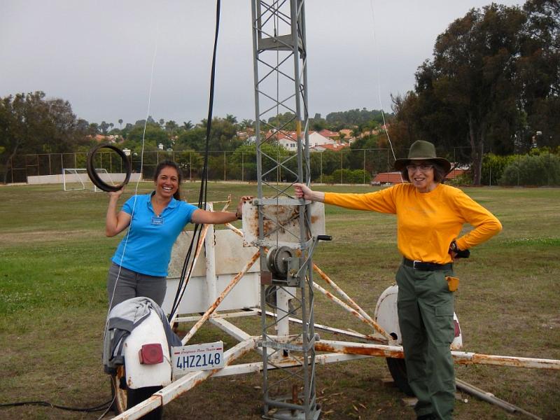 054a.jpg - Ladies celebrate after safely raising the tower:  Laura, KK6BFI, and Diana, AI6DF.