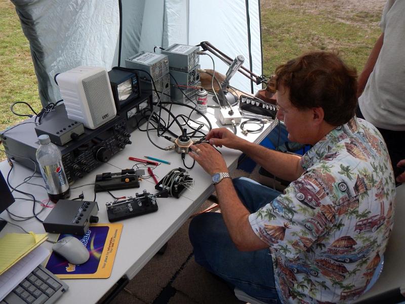 061a.jpg - Rocco, N6KN, marking CW station's antenna switch with Jerry, NG6R.