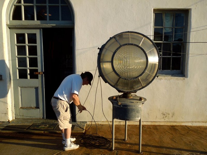 041a.jpg - Clay, AB9A, arranges coax from the hexbeam, trapped dipole, and UHF antennas over the museum lantern.