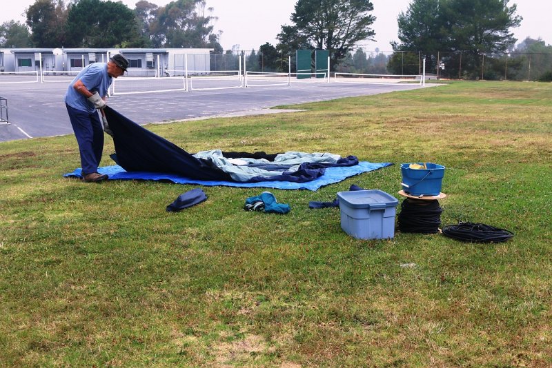 012a.jpg - Sid, KF6QFH, starts assembling CW station's tent